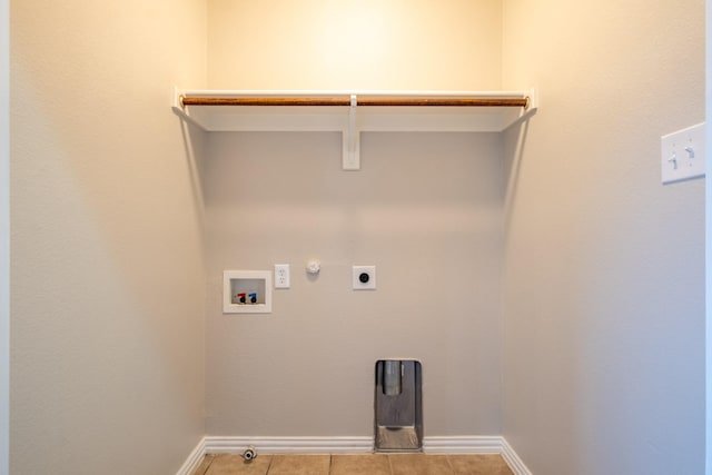 laundry room featuring hookup for an electric dryer, hookup for a gas dryer, hookup for a washing machine, and light tile patterned floors