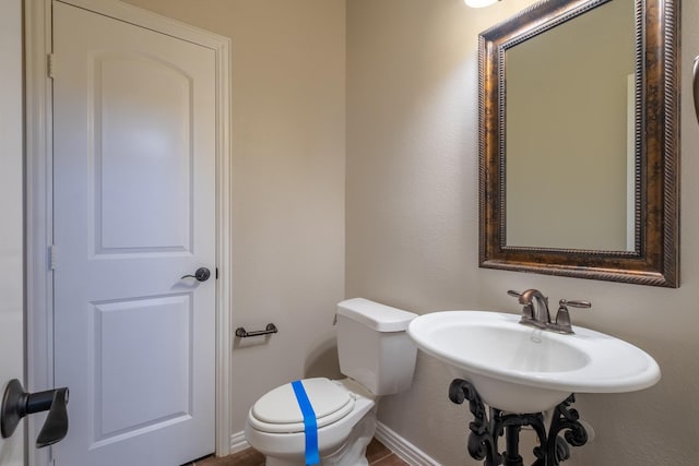 bathroom featuring toilet