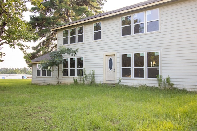 rear view of house with a lawn