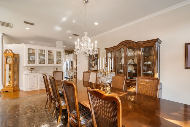 dining area with ornamental molding and an inviting chandelier