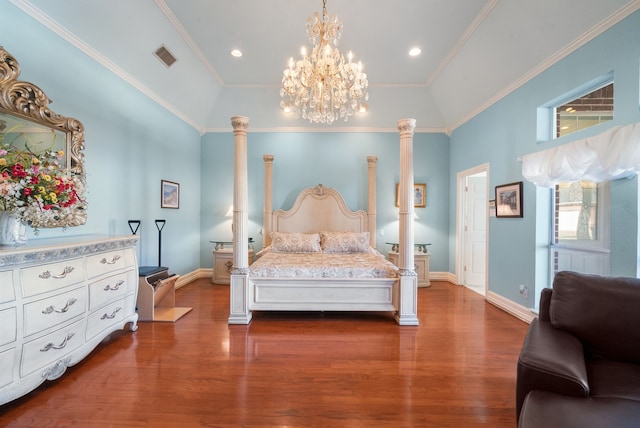 bedroom with crown molding, dark hardwood / wood-style flooring, and decorative columns