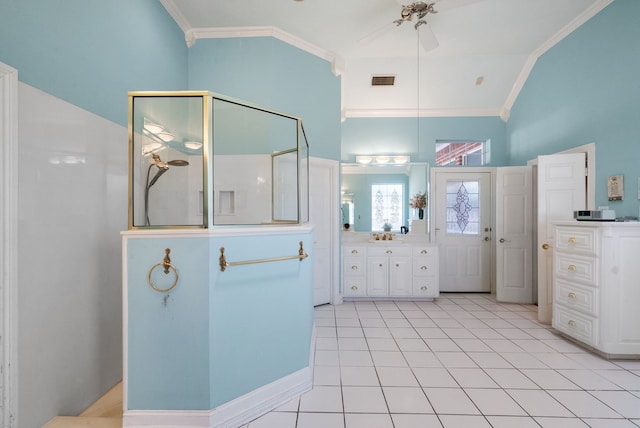 bathroom featuring lofted ceiling, ornamental molding, tile patterned floors, and vanity