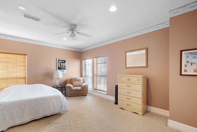 bedroom with ceiling fan, light colored carpet, and ornamental molding