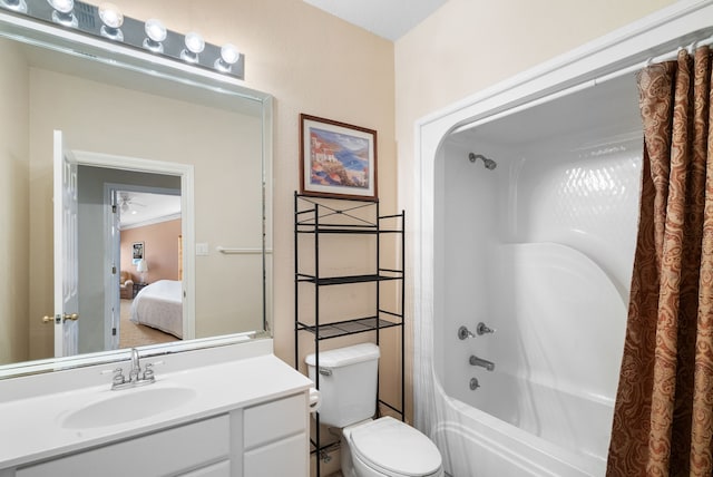 full bathroom featuring ornamental molding, vanity, toilet, and shower / tub combo