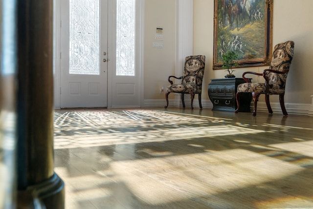 entrance foyer featuring dark hardwood / wood-style flooring and french doors