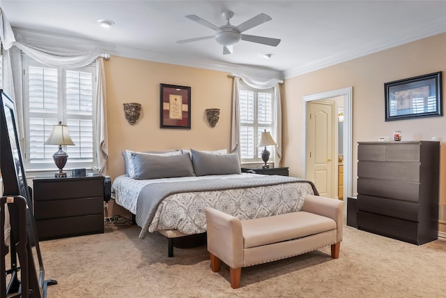 bedroom featuring ornamental molding, light carpet, and ceiling fan