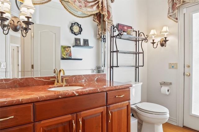 bathroom featuring vanity and toilet