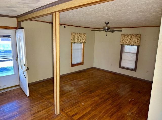 foyer featuring crown molding and dark hardwood / wood-style floors