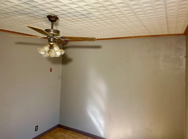 empty room featuring crown molding and light parquet flooring