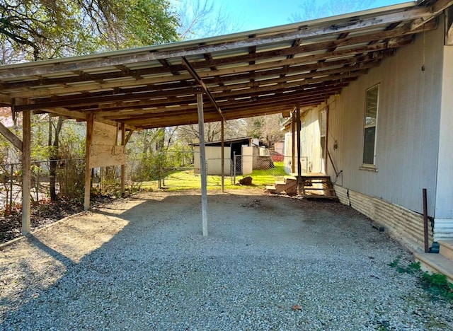 view of parking / parking lot featuring a carport