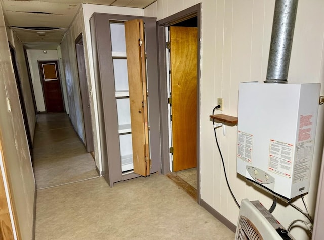 hall featuring wood walls