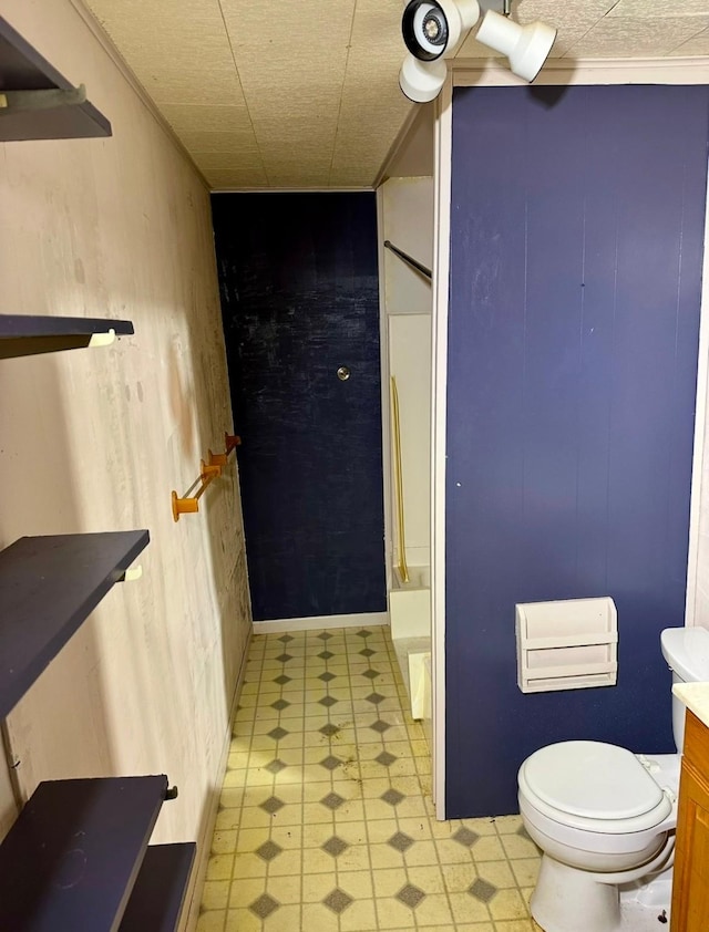 bathroom with vanity, ornamental molding, and toilet