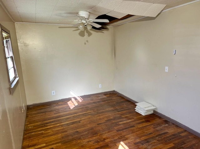 unfurnished room featuring ceiling fan and dark hardwood / wood-style flooring