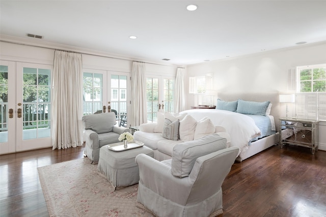 bedroom with access to exterior, dark wood-type flooring, ornamental molding, and french doors