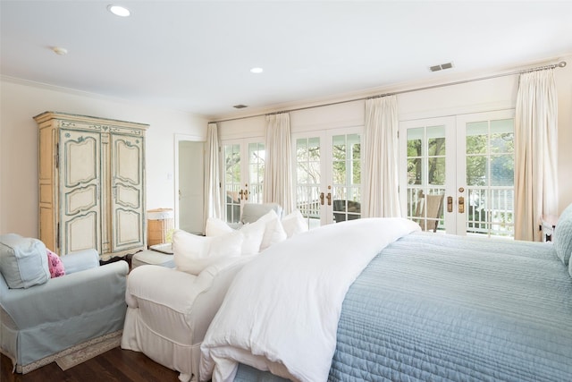 bedroom with access to exterior, wood-type flooring, and french doors