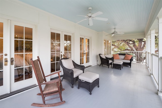 sunroom featuring french doors and ceiling fan