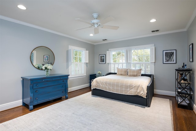 bedroom featuring ornamental molding, ceiling fan, and dark hardwood / wood-style flooring