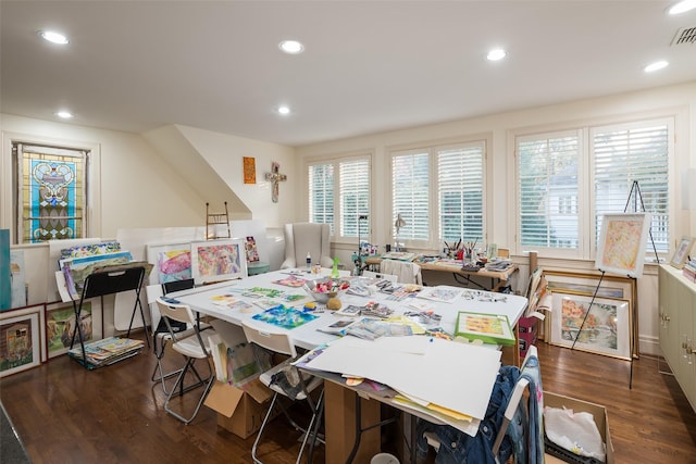 dining area with a healthy amount of sunlight and dark hardwood / wood-style flooring