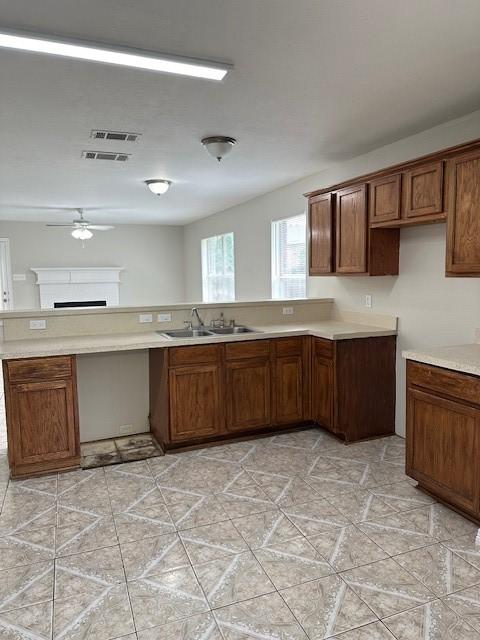 kitchen featuring sink and ceiling fan