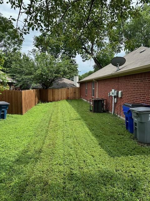 view of yard with central AC