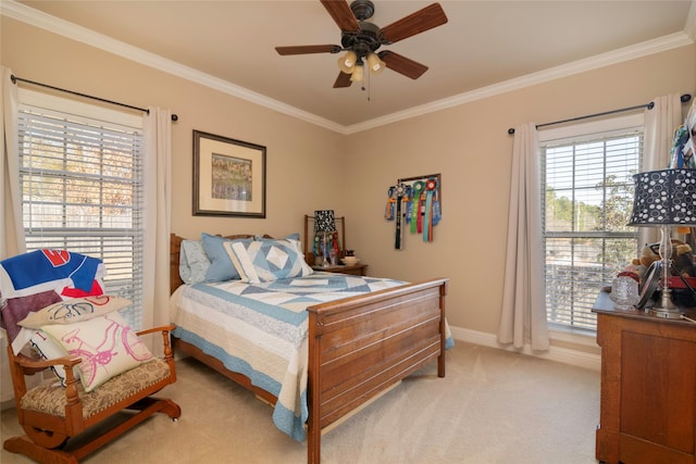 bedroom with crown molding, light colored carpet, and ceiling fan