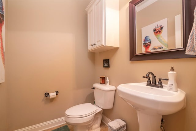 bathroom featuring sink and toilet