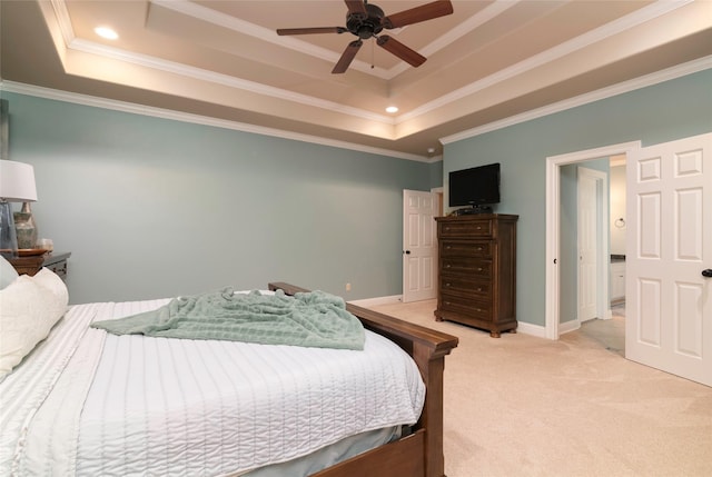 carpeted bedroom featuring a raised ceiling, crown molding, and ceiling fan