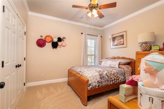 carpeted bedroom with crown molding, a closet, and ceiling fan