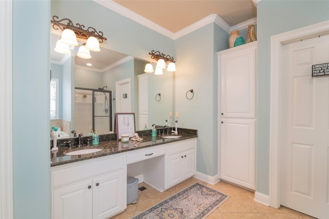 bathroom featuring an enclosed shower, vanity, crown molding, and tile patterned floors