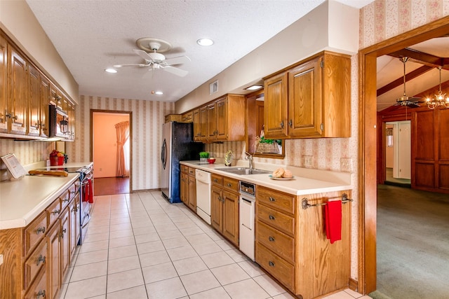 kitchen featuring sink, ceiling fan, stainless steel appliances, a textured ceiling, and light tile patterned flooring