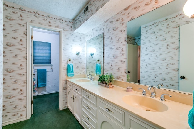 bathroom featuring vanity and a textured ceiling