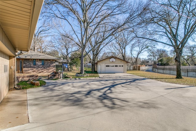 exterior space with a garage and an outdoor structure