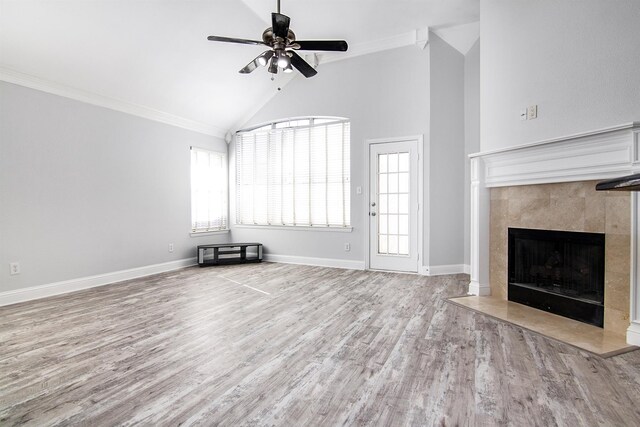 spare room featuring hardwood / wood-style flooring, vaulted ceiling, ornamental molding, and ceiling fan