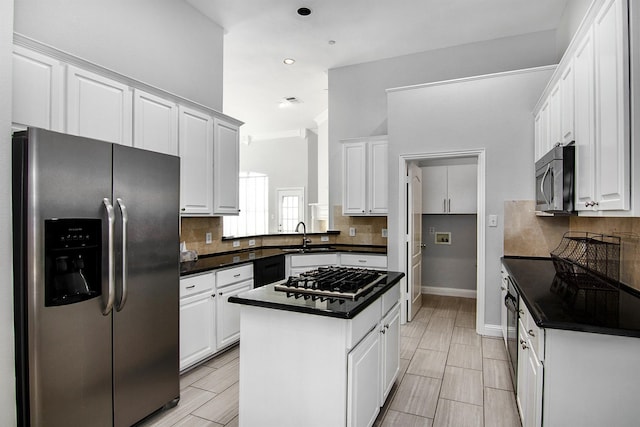 kitchen featuring stainless steel appliances and white cabinets