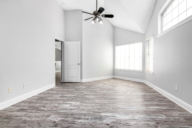 interior space with a wealth of natural light, light hardwood / wood-style floors, and ceiling fan