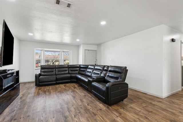 living room with dark hardwood / wood-style floors