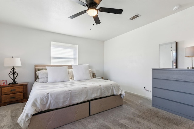 bedroom with ceiling fan and light colored carpet