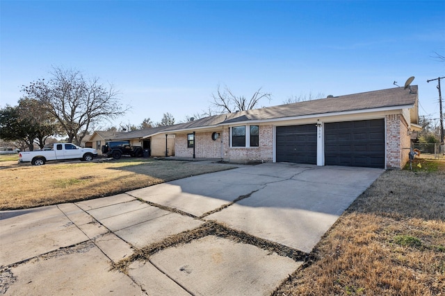 single story home featuring a garage and a front lawn