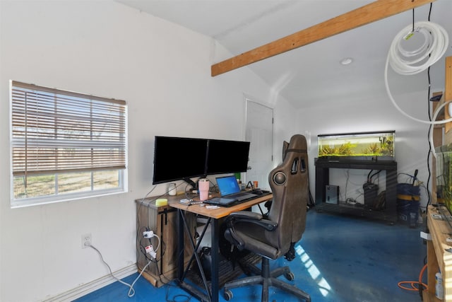 office featuring concrete flooring and vaulted ceiling with beams