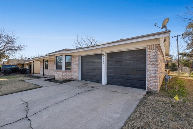 ranch-style house featuring a garage