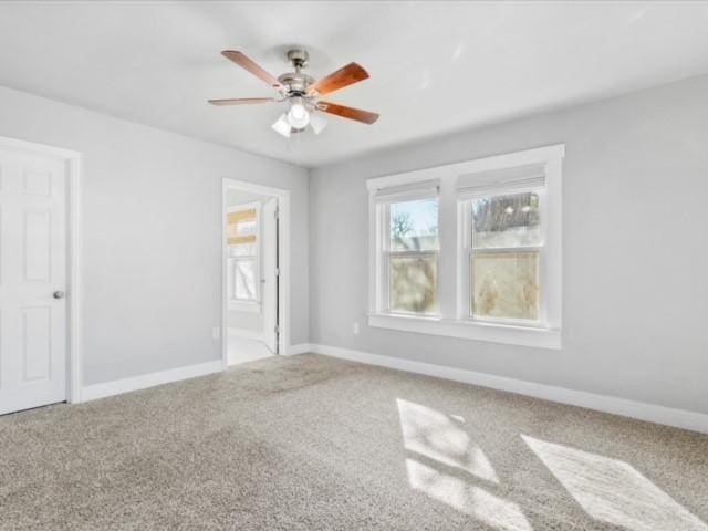 unfurnished bedroom featuring ceiling fan, connected bathroom, and carpet flooring