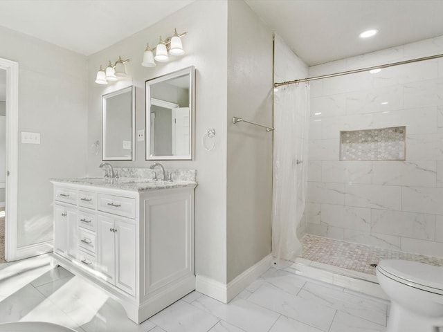 bathroom with vanity, toilet, and walk in shower