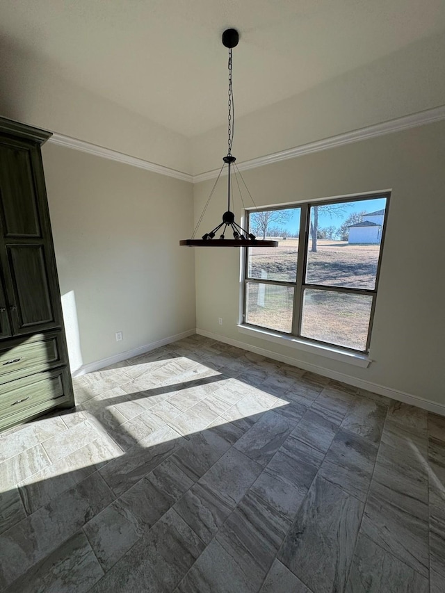 unfurnished dining area featuring ornamental molding