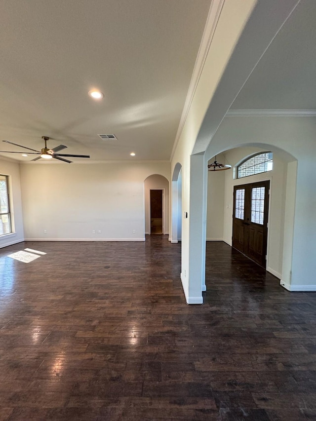 entryway featuring ornamental molding, dark hardwood / wood-style floors, and ceiling fan