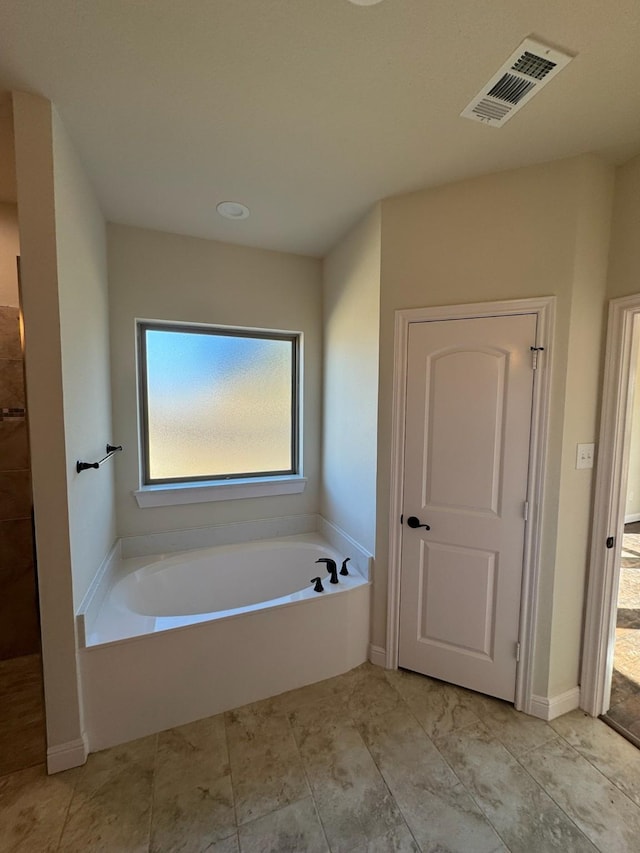 bathroom featuring a tub