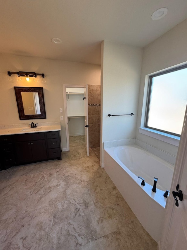 bathroom featuring vanity and a bathtub