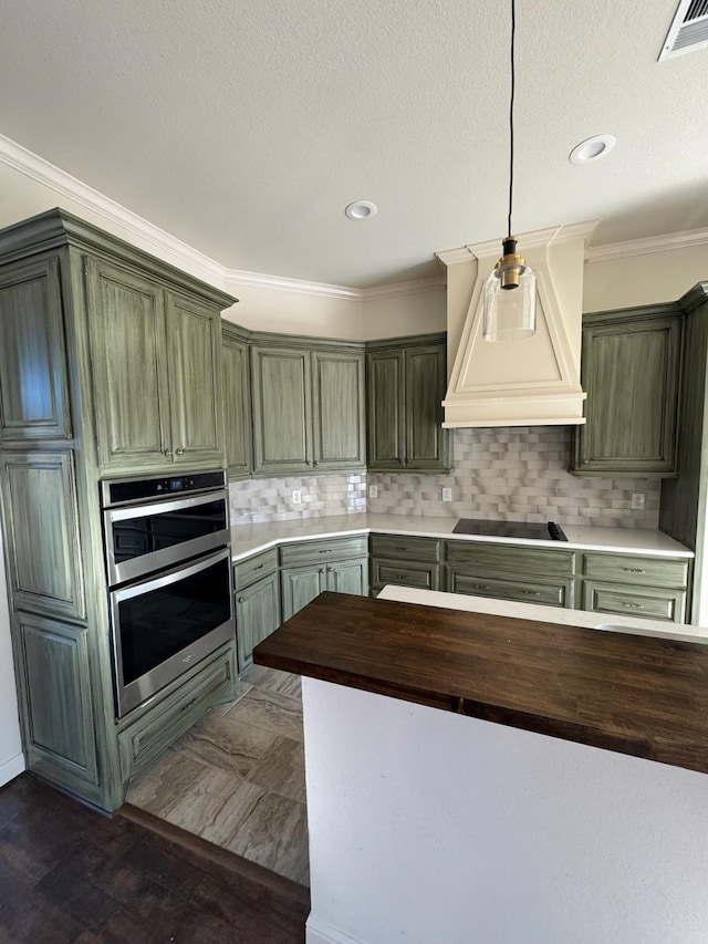 kitchen featuring double oven, decorative backsplash, ornamental molding, custom range hood, and black electric cooktop