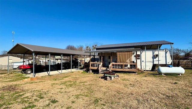 exterior space featuring a yard and a carport