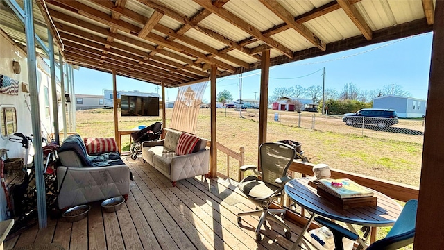 wooden deck with a yard