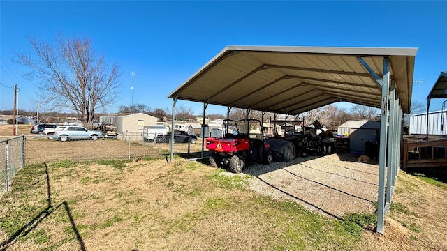 view of vehicle parking with a carport